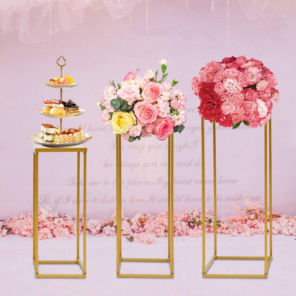 Gold wedding stands for floral centerpieces