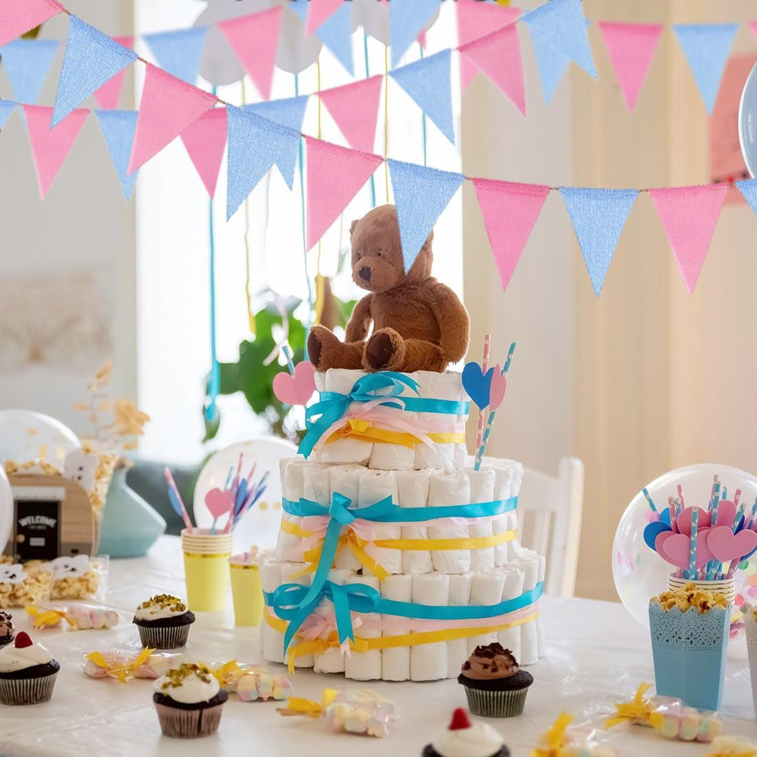 Gender reveal party banner with pink and blue flags