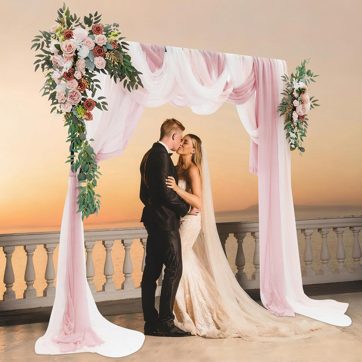 Pink floral arch décor for wedding ceremonies