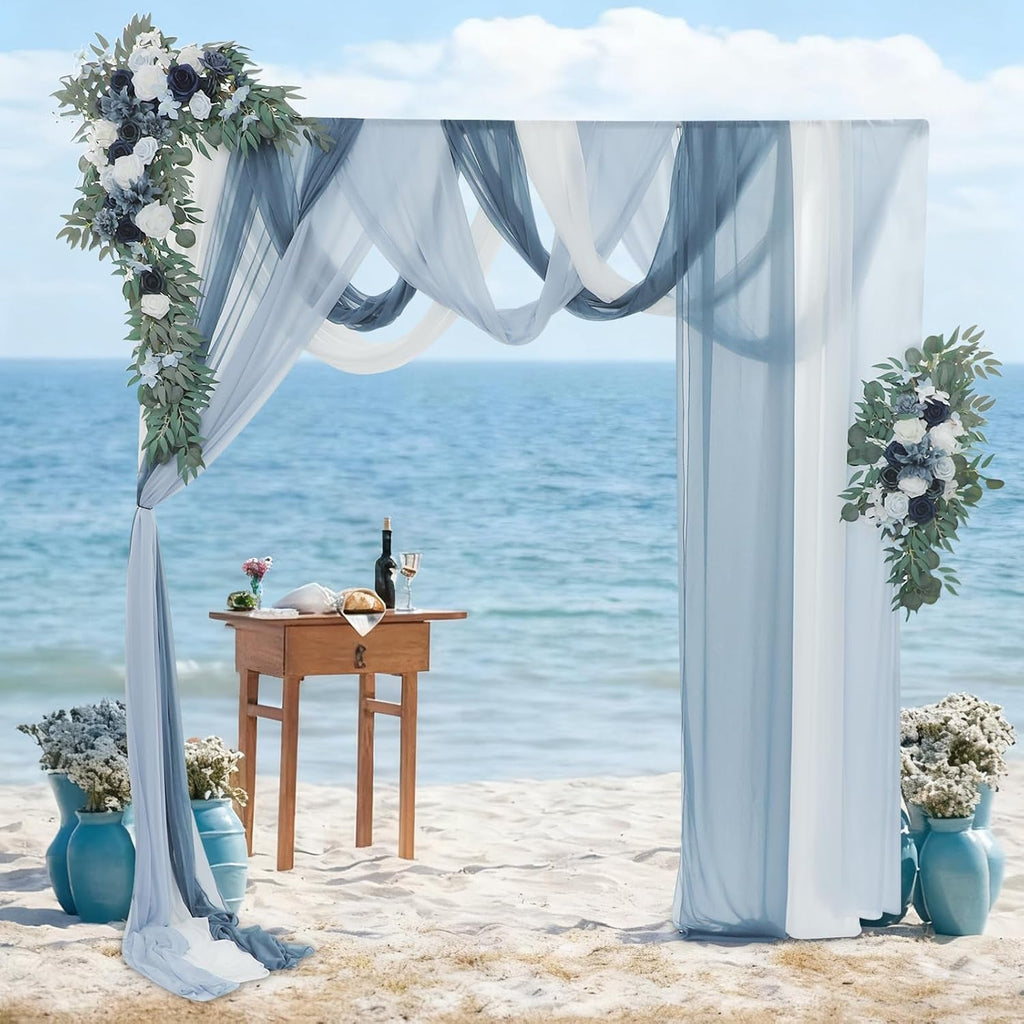 Blue wedding arch flowers with chiffon drapes