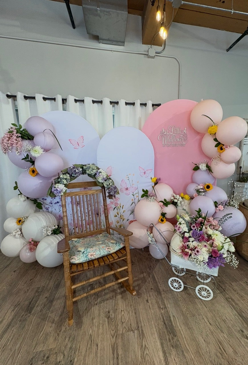 Pastel balloon and floral event backdrop by Pinopoles