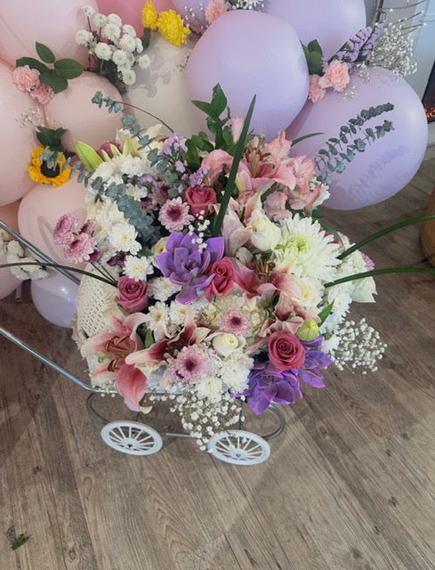 Floral pram arrangement styled by Pinopoles