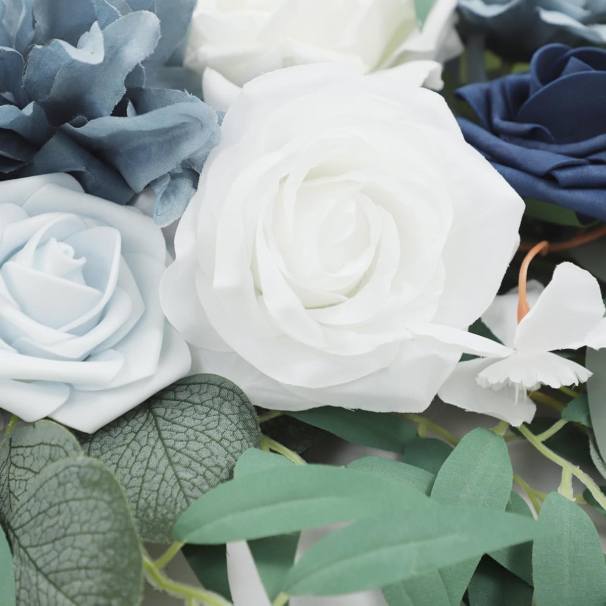 Blue ceremony arch flowers and drapes