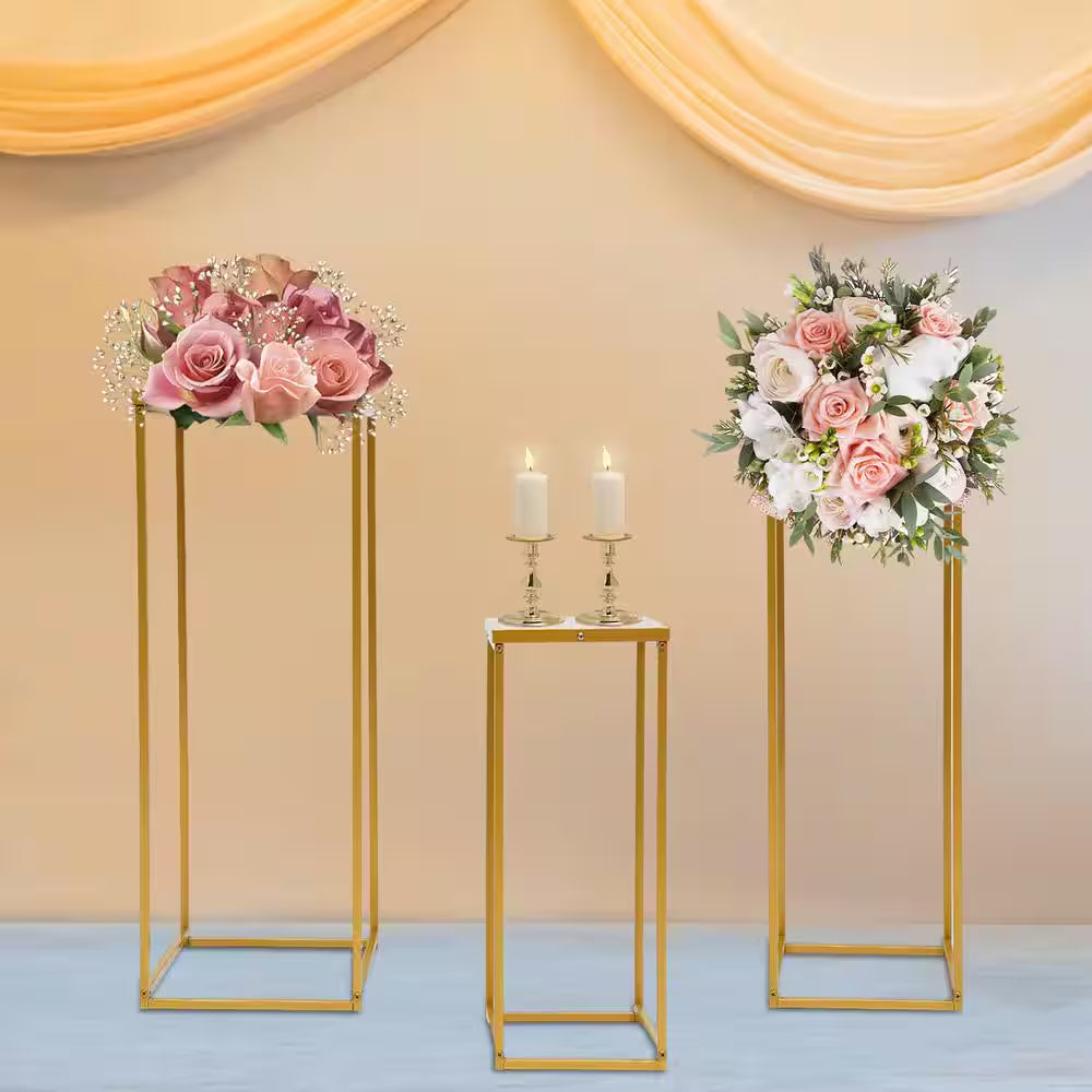 Set of three gold metal centerpiece stands