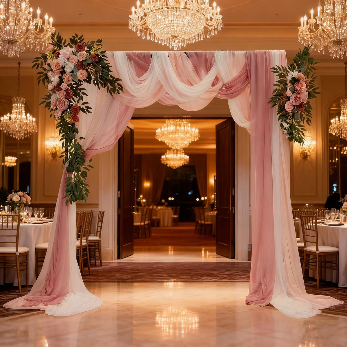 Pink wedding arch flowers with chiffon drapes
