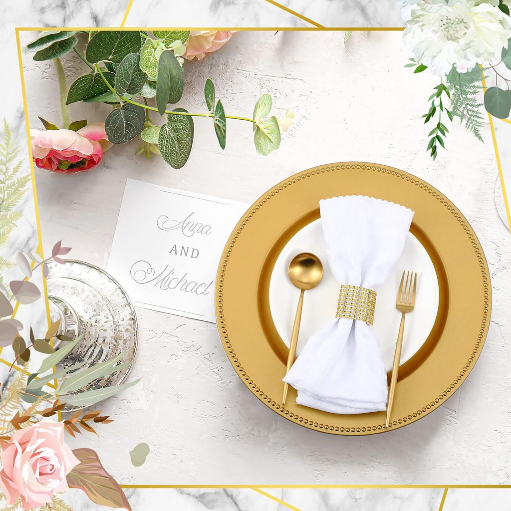 Wedding table décor with gold chargers and napkin rings