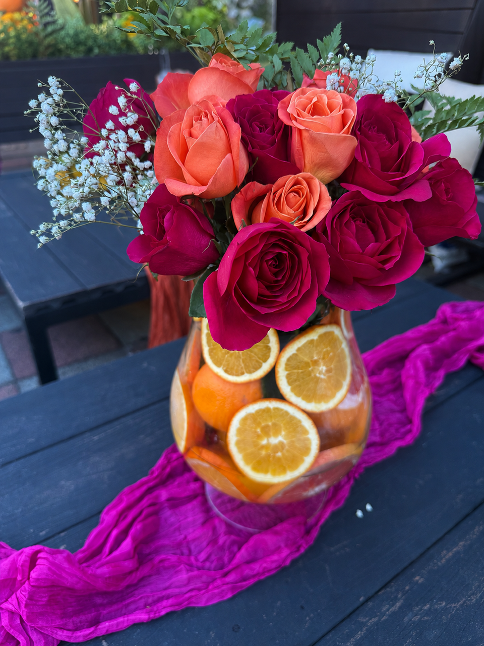 Vibrant rose and citrus centerpiece by Pinopoles