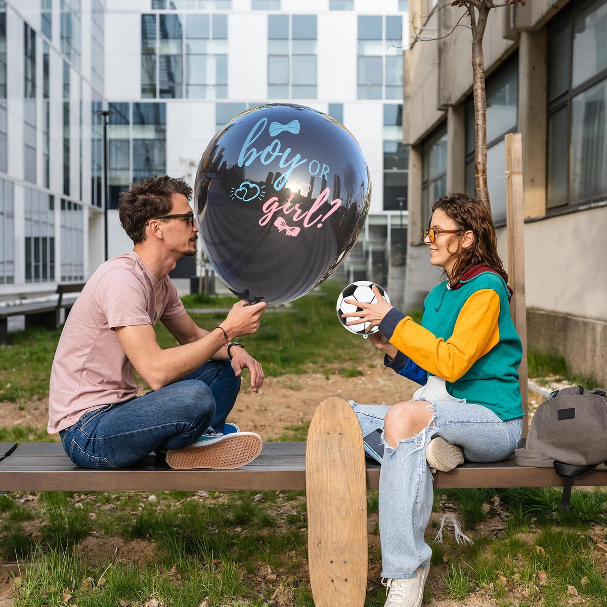 Gender reveal ball with pink and blue powder packets